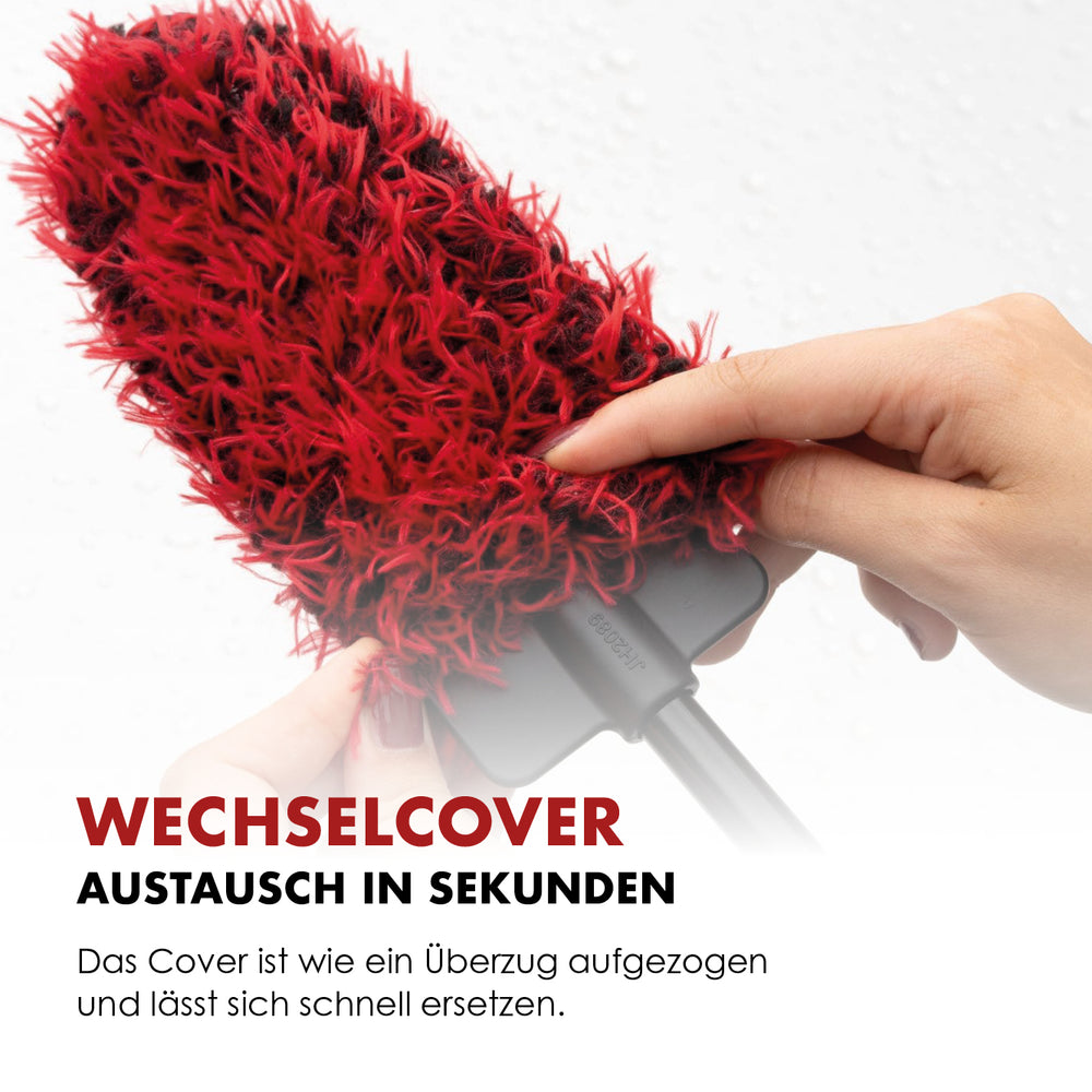 Red microfibre cover being removed from the flat brush head for replacement