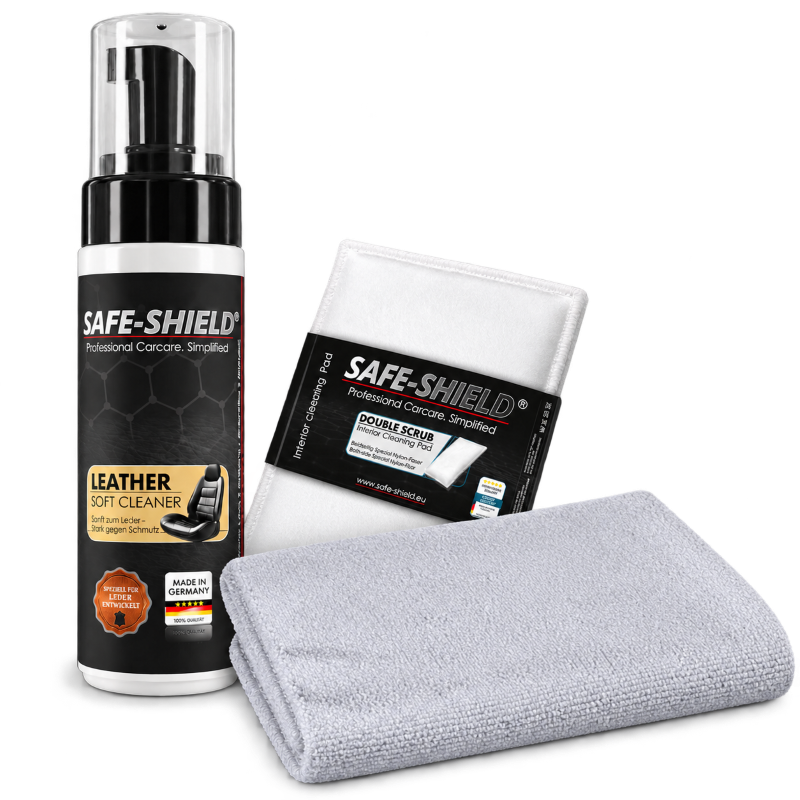 Safe-Shield leather cleaning kit with Leather Soft Cleaner, a Double Scrub Pad and a grey edgeless microfibre cloth.